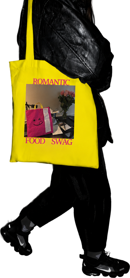 Yellow tote bag with a pink FeedMe bag photo and the text: Romantic food swag